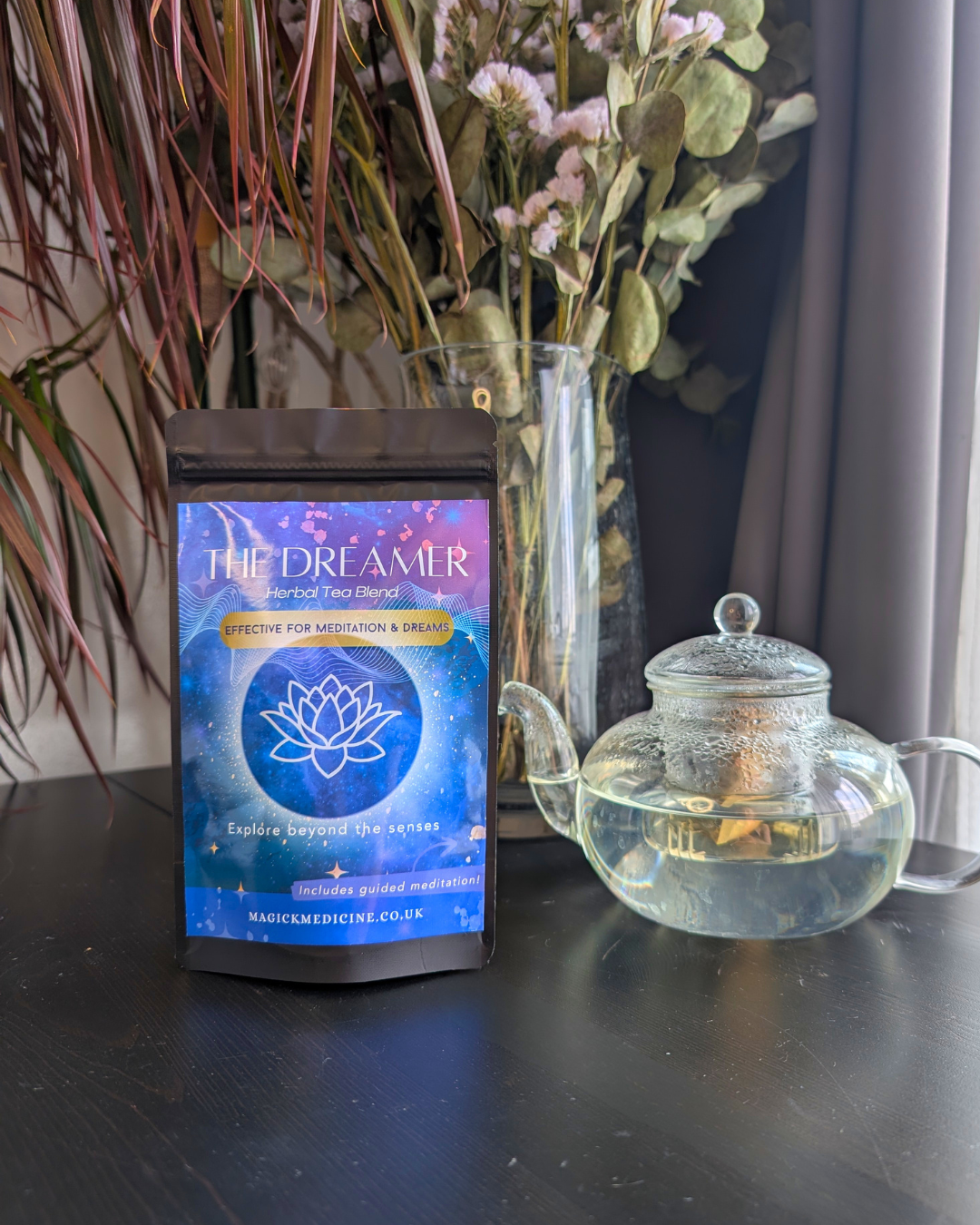 The Dreamer pack beside a teapot, brewed and ready to pour