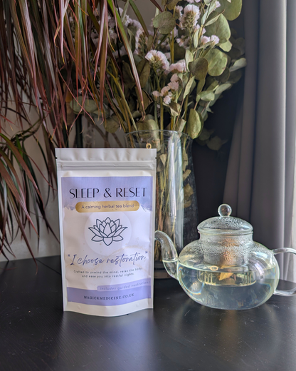 Sleep & Reset pack beside a teapot, brewed and ready to pour